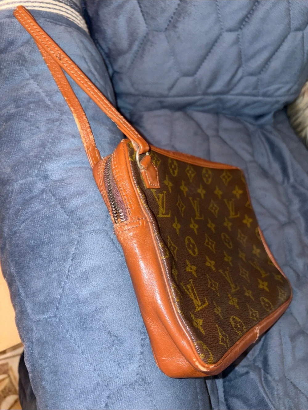 Louis Vuitton Brown Leather Monogram cosmetic case with wristlet strap.